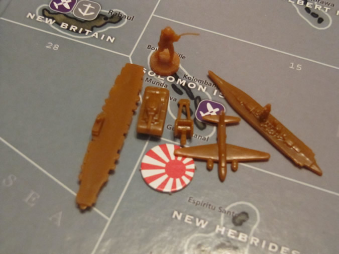 a picture showing of a selection of Axis & Allies: Pacific Japanese pieces in burnt orange